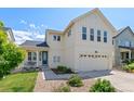 Charming two-story home with a covered front porch and an attached two-car garage at 4670 Tanner Peak Trl, Brighton, CO 80601