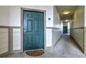 The door to the unit 308 of the building, in the hallway leading to the exit at 3854 S Dayton St # 308, Aurora, CO 80014