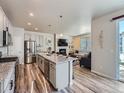 Modern kitchen with stainless steel appliances and island at 9008 Birch Run Dr, Parker, CO 80134