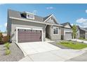 Attractive home showcasing a well-kept lawn, a cozy design, and a convenient driveway at 5909 S Platte Canyon Dr, Littleton, CO 80123