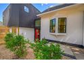 Modern addition with red door and large windows, complementing the original structure at 1029 9Th St, Boulder, CO 80302