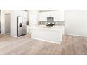 Spacious open kitchen with stainless steel appliances and large center island at 22415 E 7Th Pl, Aurora, CO 80018