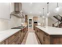 Modern kitchen featuring a large island and gas range at 1149 S Madison St, Denver, CO 80210