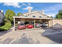 Assigned covered parking near a well-maintained multi-unit residential building at 3857 Mossy Rock Dr # 201, Highlands Ranch, CO 80126