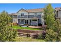 Spacious backyard featuring a patio, terraced landscaping, and a privacy fence, perfect for outdoor entertaining and relaxation at 2307 Candleglow St, Castle Rock, CO 80109