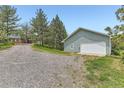 Garage exterior and driveway showcasing the proximity of the detached garage at 6351 S Andes Pl, Centennial, CO 80016