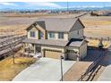 Suburban home featuring a three-car garage, large driveway and beautiful mountain views at 16525 Sanford St, Mead, CO 80542