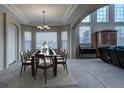 Bright dining room features a large table with seating for six and large windows at 1035 Cryolite Pl, Castle Rock, CO 80108