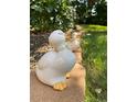 Quaint duck statues adorning the outdoor garden, adding a touch of whimsy and charm to the landscape at 8705 W 86Th Dr, Arvada, CO 80005