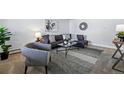 Open living room features modern decor, and a comfortable couch perfect for relaxation at 2595 S Sheridan Blvd # 20, Denver, CO 80227