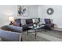 Bright living room features an open layout, comfortable couch, and stylish decor at 2595 S Sheridan Blvd # 20, Denver, CO 80227