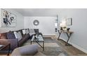 Comfortable living room showcasing an open layout with stylish décor and lots of light at 2595 S Sheridan Blvd # 20, Denver, CO 80227