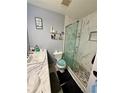 Updated bathroom featuring a glass-enclosed shower and marble countertop at 1652 S Idalia Cir # C, Aurora, CO 80017