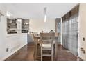 Kitchen dining area with wood table and four chairs at 961 S Evanston Cir, Aurora, CO 80012