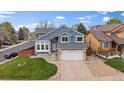 Charming two-story home with a well-manicured lawn and a two-car garage at 5486 S Cathay Way, Centennial, CO 80015