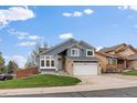 Charming two-story home with a well-manicured lawn and a two-car garage at 5486 S Cathay Way, Centennial, CO 80015