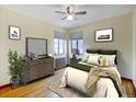 Bright bedroom with hardwood floors, natural light and a ceiling fan at 1605 Saint Paul St # 6, Denver, CO 80206