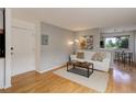 Inviting living room with natural light, plush sofa, and an open layout at 21 N Washington St # 301, Denver, CO 80203