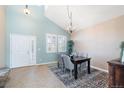 Elegant dining room with vaulted ceilings, chandelier lighting, and plenty of natural light at 10978 Ashurst Ln, Highlands Ranch, CO 80130