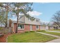 Lovely home featuring a brick facade, well-maintained landscaping, and a spacious front yard at 4623 S Kalispell Way, Aurora, CO 80015