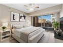 Inviting bedroom featuring a private balcony, neutral color palette, and ample natural light at 1121 Albion St # 305, Denver, CO 80220