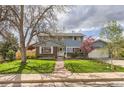 Charming blue two-story home with well-maintained front yard and mature tree at 4707 Ashfield Ct, Boulder, CO 80301