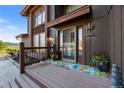 Charming front entrance with a decorative porch and appealing landscaping details at 3900 Bogey Ct, Longmont, CO 80503