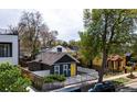 Aerial view of a quaint home featuring a charming exterior, fenced yard, and convenient street parking at 444 Inca St, Denver, CO 80204
