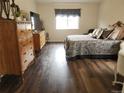 Well-decorated bedroom with wood floors and natural light at 21924 E Lake Ave, Aurora, CO 80015