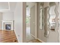 Open-concept living space with fireplace, abundant natural light, and stylish design at 4545 Oxbow Dr, Brighton, CO 80601
