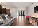 Open living room with wood floors, neutral paint, and lots of natural light at 12603 E Ohio Ave, Aurora, CO 80012
