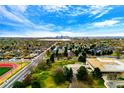Scenic aerial view overlooking the Denver skyline, lush greenery, and established residential neighborhood at 7080 W 20Th Ave # 202, Lakewood, CO 80214