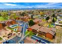 Aerial view of the complex showing mature trees, parking and a shared pool with mountain views at 7080 W 20Th Ave # 202, Lakewood, CO 80214