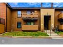 Charming condo with private balcony and well-maintained front lawn, situated on a quiet street at 7080 W 20Th Ave # 202, Lakewood, CO 80214