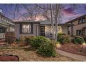 Charming single-story home with manicured landscaping and a welcoming front porch, photographed at twilight at 1380 S Fillmore St, Denver, CO 80210