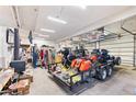 Bright garage interior showcasing multiple motorcycles on a trailer and various tools at 9061 N Rex Ln, Conifer, CO 80433