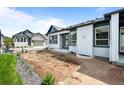 The backyard features a blank canvas ready for landscaping, with a concrete patio extending from the home at 8277 S Quail St, Littleton, CO 80127