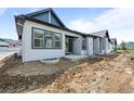 The backyard features a blank canvas ready for landscaping, with a concrete patio extending from the home at 8277 S Quail St, Littleton, CO 80127