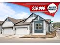 Charming two-story home featuring a white exterior, dark blue accents, an attached two-car garage and an unfinished lawn at 8277 S Quail St, Littleton, CO 80127