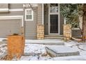 Close-up of the front entrance with stone pillar accents and a well-maintained front door at 364 Willowick Cir, Highlands Ranch, CO 80129