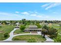 Expansive aerial view of home and property, complete with circular driveway and outbuildings at 15545 Lipan St, Broomfield, CO 80023