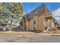 Beautiful multi-story exterior showcasing private balconies and well-maintained landscaping at 7695 E Quincy Ave # 105, Denver, CO 80237