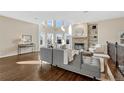 Spacious living room with hardwood floors, fireplace, and abundant natural light at 2 Garfield St # B, Denver, CO 80206