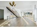 Open floor plan with lots of light, featuring a staircase with wood treads and metal railings at 5392 Lions Paw St, Castle Rock, CO 80104