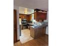 Functional kitchen with stainless steel appliances and ample countertop space for food preparation at 8278 Cherokee St, Denver, CO 80221