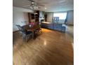 Spacious living room with hardwood floors, a cozy fireplace, and large windows that offer abundant natural light at 8278 Cherokee St, Denver, CO 80221