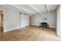 Spacious living room with a modern sliding door, fireplace, and light-filled atmosphere at 9700 E Iliff Ave # 81, Denver, CO 80231