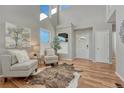 Bright foyer with soaring ceilings, wood floors, and stylish decor at 17050 Park Trail Dr, Monument, CO 80132