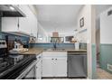 Modern kitchen view with stainless steel appliances, light countertops, and stylish backsplash at 8773 W Cornell Ave # 10, Lakewood, CO 80227