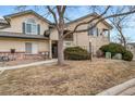 Well-maintained townhome with a front lawn and assigned parking at 8621 E Dry Creek Rd # 325, Englewood, CO 80112